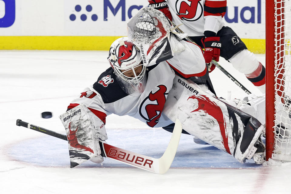 New Jersey Devils goaltender Vitek Vanecek (41) blocks a shot from the Carolina Hurricanes during the second period of Game 1 of an NHL hockey Stanley Cup second-round playoff series in Raleigh, N.C., Wednesday, May 3, 2023. (AP Photo/Karl B DeBlaker)