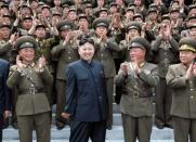 North Korean leader Kim Jong-Un surrounded by military officers in Pyongyang in May 2012. The North's military has in recent months ratcheted up hostile rhetoric towards South Korea and its President Lee Myung-Bak, partly in a bid to burnish Kim Jong-Un's credentials