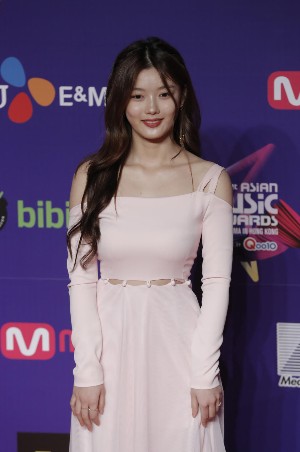 South Korean actress Kim Yoo-jung poses for photos on the red carpet of the Mnet Asian Music Awards (MAMA) in Hong Kong, Friday, Dec. 1, 2017. (AP Photo/Kin Cheung)