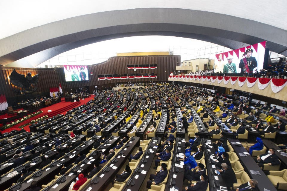 Members of the parliament listen as Indonesian President Joko Widodo delivers his annual State of the Nation Address ahead of the country's Independence Day, at the parliament building in Jakarta, Indonesia, Tuesday, Aug. 16, 2022. (Bagus Indahono/Pool Photo via AP)