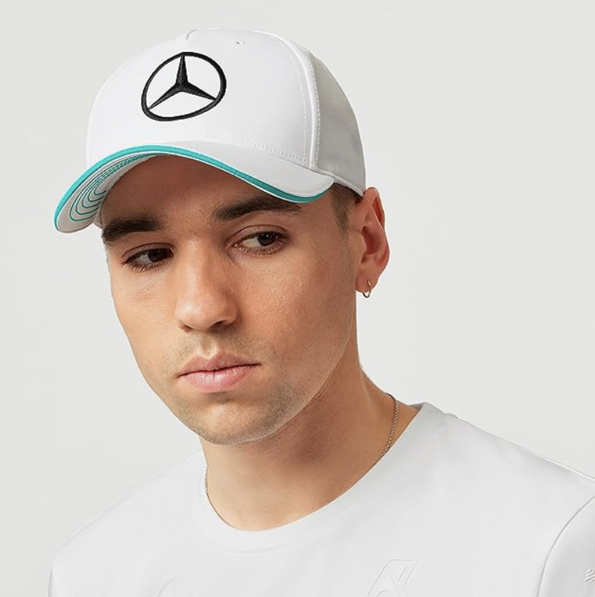 A photo of a model wearing a Mercedes AMG Petronas Formula One Team - 2023 Team Hat. (PHOTO: Amazon Singapore)
