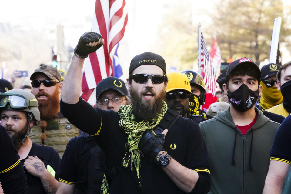 People identifying themselves as members of the Proud Boys join supporters of President Donald Trump as they march Saturday Nov. 14, 2020, in Washington. (AP Photo/Jacquelyn Martin)