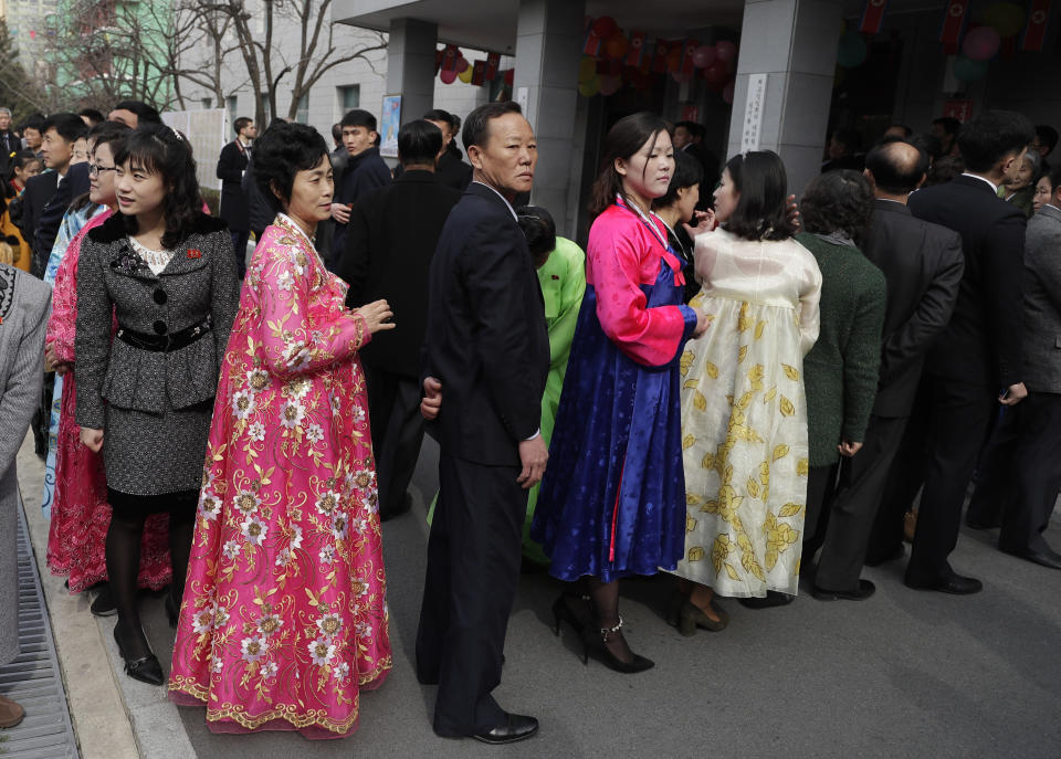 North Koreans line up to vote during the election at a polling station in Pyongyang, North Korea, Sunday, March 10, 2019. Millions of North Korean voters, including leader Kim Jong Un, are going to the polls to elect roughly 700 members to the national legislature. In typical North Korean style, voters are presented with just one state-sanctioned candidate per district and they cast ballots to show their approval or, very rarely, disapproval. (AP Photo/Dita Alangkara)