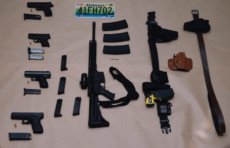 Authorities collected weapons from a Cadillac sedan in which Alabama fugitives Casey White and Vicky White fled from police May 9.
