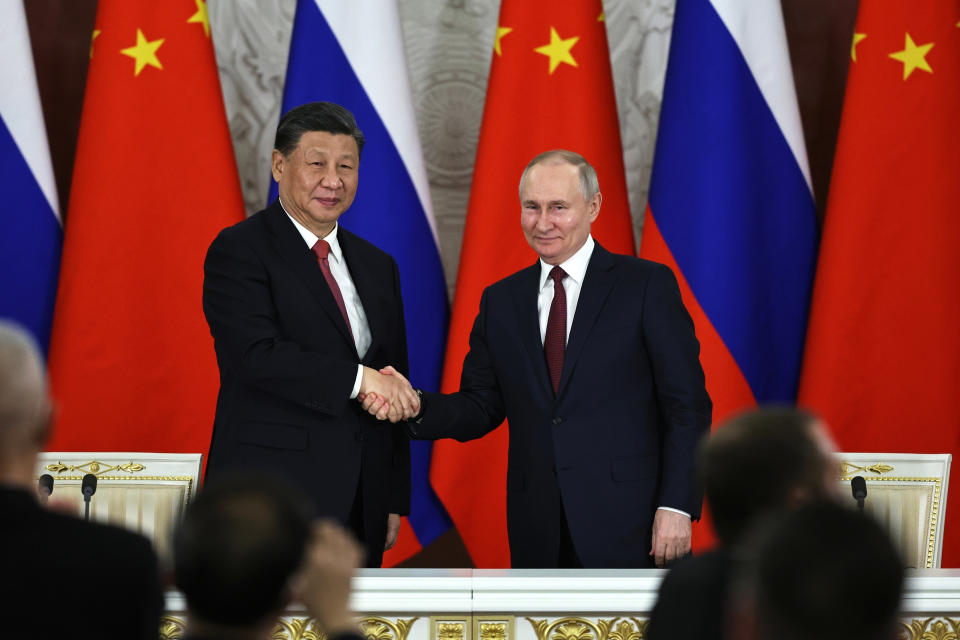 FILE - Russian President Vladimir Putin, right, and Chinese President Xi Jinping shake hands after speaking to the media during a signing ceremony following their talks at The Grand Kremlin Palace, in Moscow, Russia, March 21, 2023. Russian President Putin is expected to meet this week with Chinese leaders in Beijing on a visit that underscores China’s economic and diplomatic support for Moscow during its war in Ukraine. (Mikhail Tereshchenko, Sputnik, Kremlin Pool Photo via AP, File)