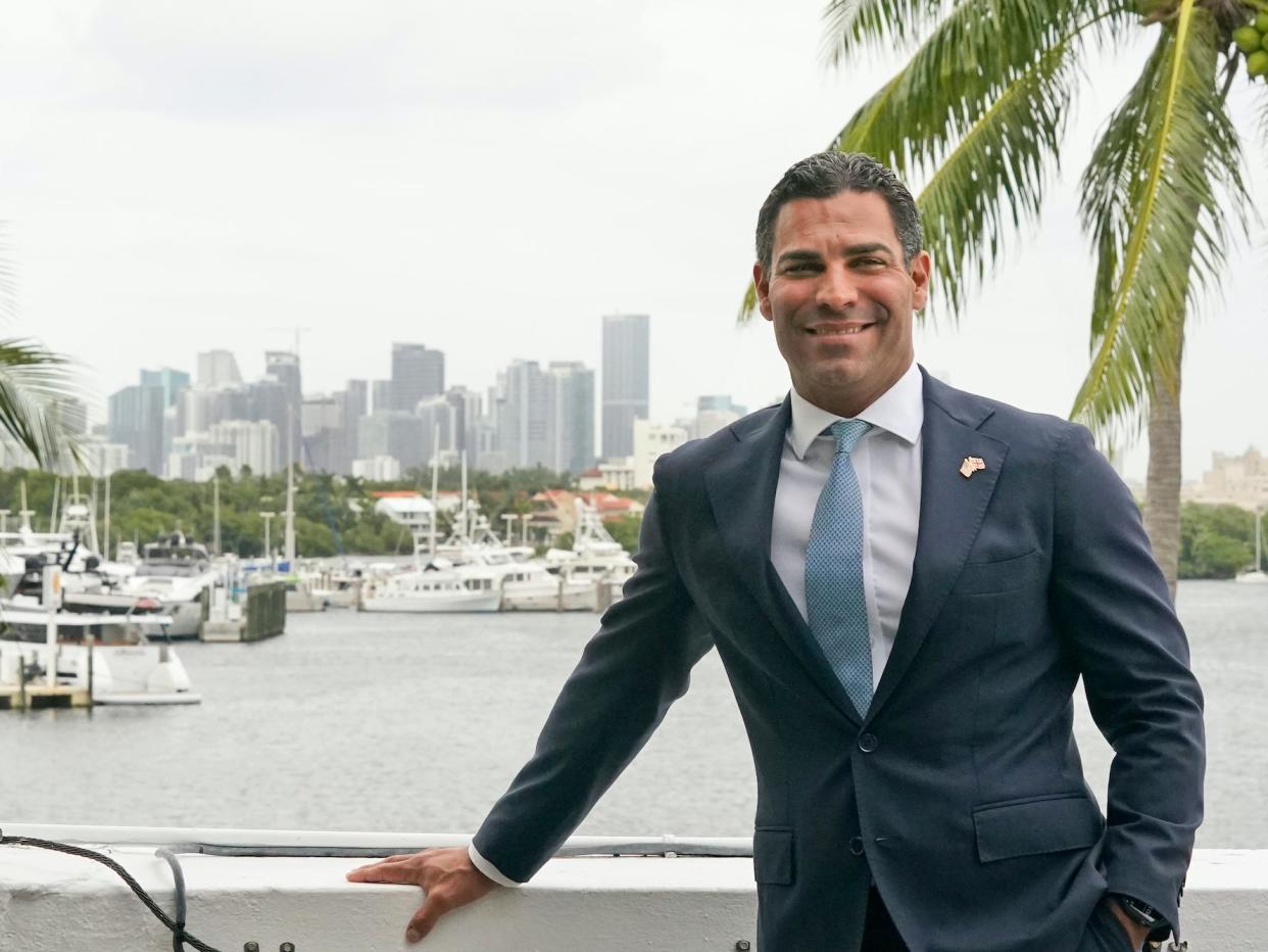Miami Mayor Francis Suarez poses for a photo with the Miami skyline, Friday, October 29, 2021, at City Hall in Miami.