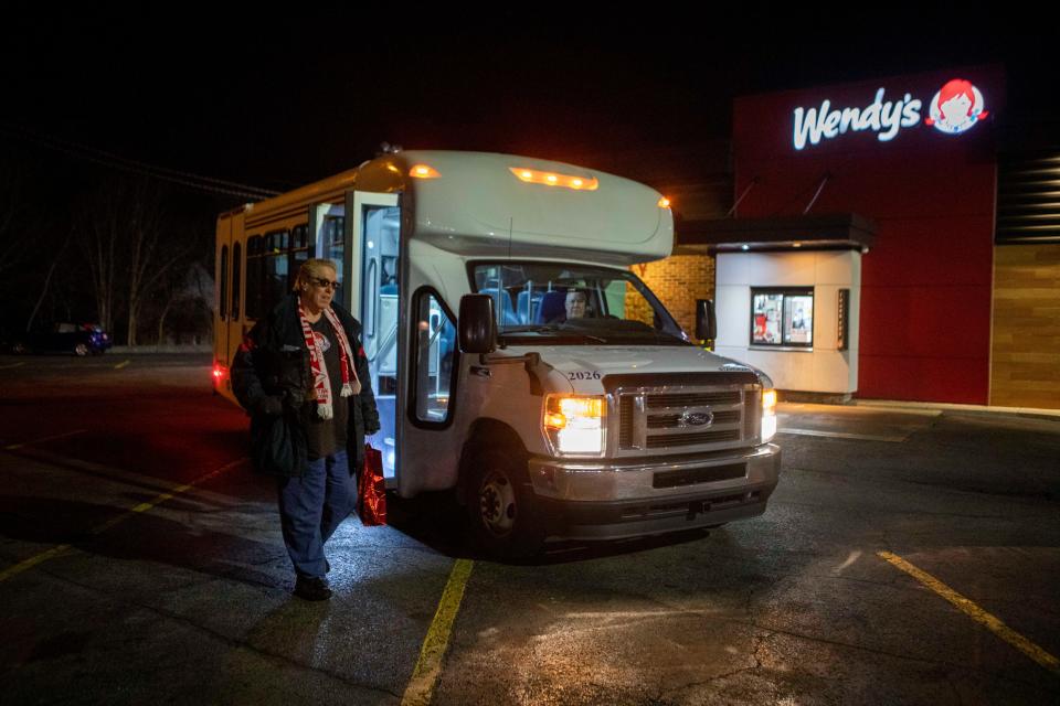Mark Minter, of Chillicothe, gets off the bus and walks into work at Wendy's on Dec. 20, 2022 in Chillicothe, Ohio. The Chillicothe Transit System provides free transportation for local passengers in need of transportation around the Chillicothe area.