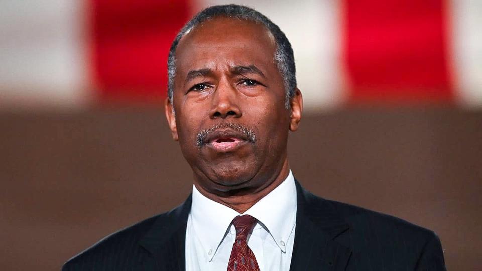 Dr. Ben Carson wearing a suit and tie