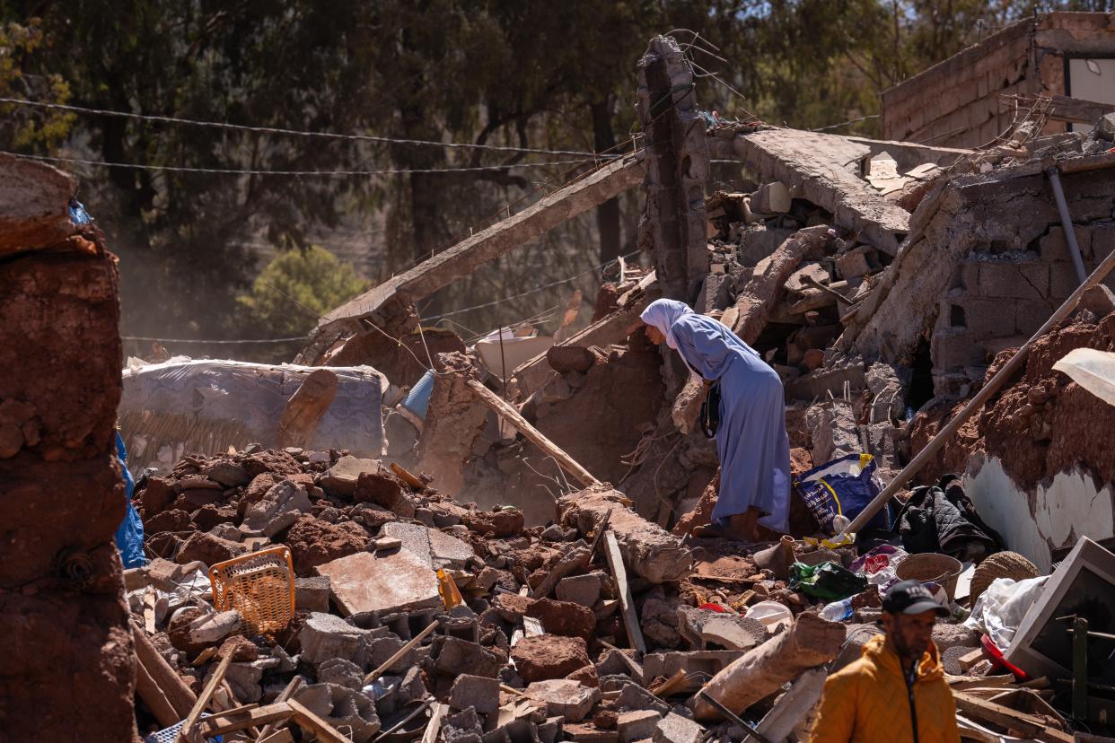 MOULAY BRAHIM, MOROCCO - SEPTEMBER 10: A woman looks into the rubble of a collapsed building on September 10, 2023 in Moulay Brahim, Morocco. An earthquake measuring 6.8 on the Richter scale hit central Morocco. Although the epicenter was in a sparsely populated area of the High Atlas Mountains, the effects have been felt 71km away in Marrakesh, a major tourist destination, where many buildings have collapsed and over 2,000 deaths have been reported. (Photo by Carl Court/Getty Images) (Getty Images)