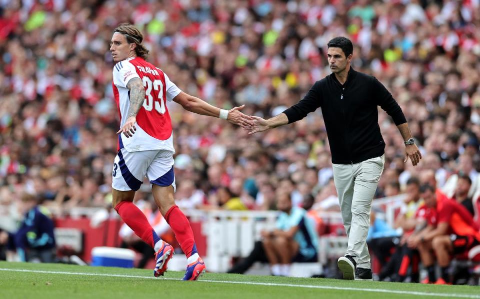 Arteta with new signing, defender Riccardo Calafiori (Getty)