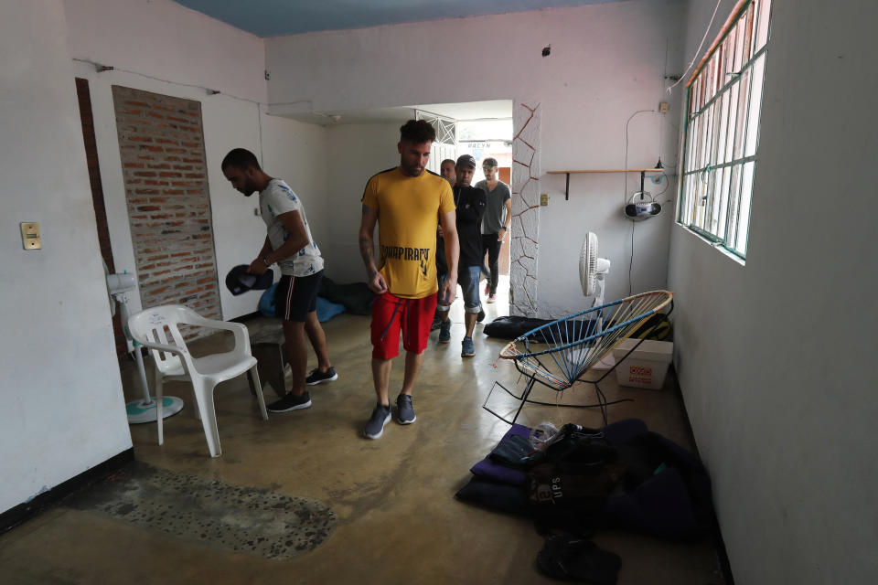 In this May 28, 2019 photo, Cuban migrants make themselves comfortable at a house they rented in Tapachula, Chiapas state, México. The group said that they were detained and beaten by Mexican immigration authorities. Some gave in and agreed to be deported. These held out and were released after filing asylum requests, though they are barred from leaving Tapachula. (AP Photo/Marco Ugarte)