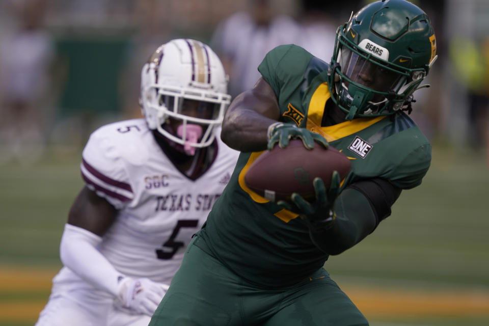 Baylor tight end Kelsey Johnson (87) catches a pass as Texas State safety DeJordan Mask (5) defends during the first half of an NCAA college football game in Waco, Texas, Saturday, Sept. 17, 2022. (AP Photo/LM Otero)