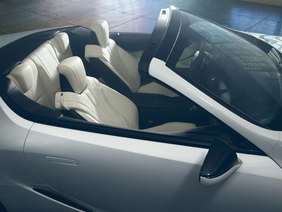 <p>Yes, those are two seats you're seeing stuffed into the back of the LC convertible concept. We suspect they're about as usable as the shelves with seatbelts that adorn Porsche's 911. Look for the production model, should it happen, to stow its folding cloth roof behind these seats; that storage spot likely nixes the LC500h hybrid coupe's powertrain from the convertible roster, since its battery pack lives where the top would go. Instead, look for the LC500 coupe's 5.0-liter V-8 engine to be the lone powertrain option.</p>