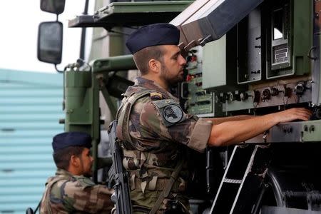 French soldiers work in weapon systems during the exercise 'Aurora 17' at Save airfield in Goteborg, Sweden September 13, 2017. Henrik Brunnsgard/TT News Agency/via REUTERS