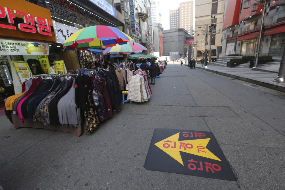 FILE - In this Dec. 7, 2020, file photo, an outdoor shopping street remains vacant amid fears of the coronavirus in Seoul, South Korea. South Korea had seemed to be winning the fight against the coronavirus: Quickly ramping up its testing, contact-tracing and quarantine efforts paid off when it weathered an early outbreak without the economic pain of a lockdown. But a deadly resurgence has reached new heights during Christmas week, prompting soul-searching on how the nation sleepwalked into a crisis. (AP Photo/Ahn Young-joon, File)