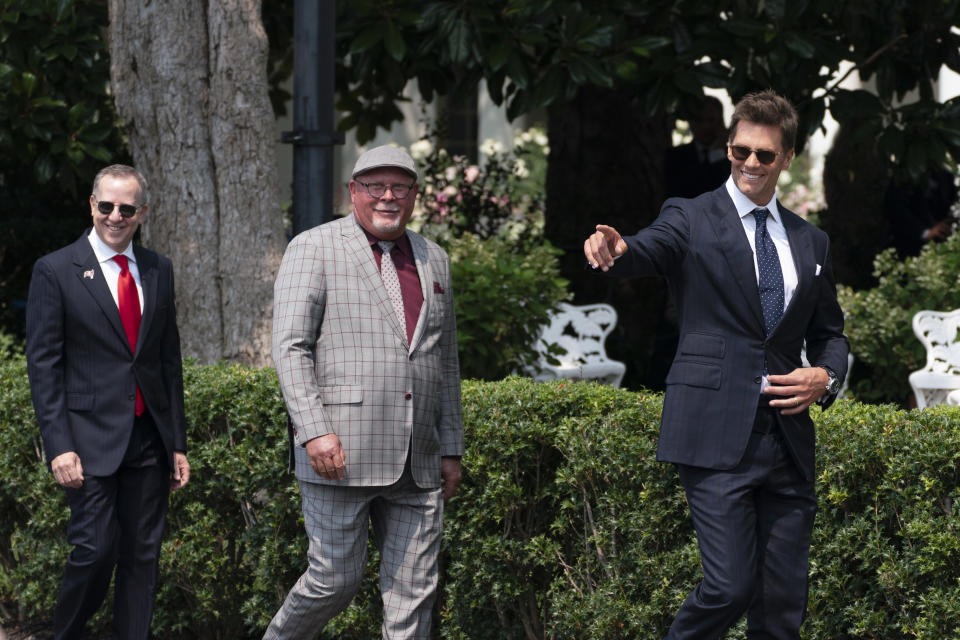 Tampa Bay Buccaneers quarterback Tom Brady, head coach Bruce Arians and Buccaneers co-owner Bryan Glazer, arrive for a ceremony on the South Lawn of the White House, in Washington, Tuesday, July 20, 2021, where President Joe Biden honored the Super Bowl Champion Tampa Bay Buccaneers for their Super Bowl LV victory. (AP Photo/Manuel Balce Ceneta)