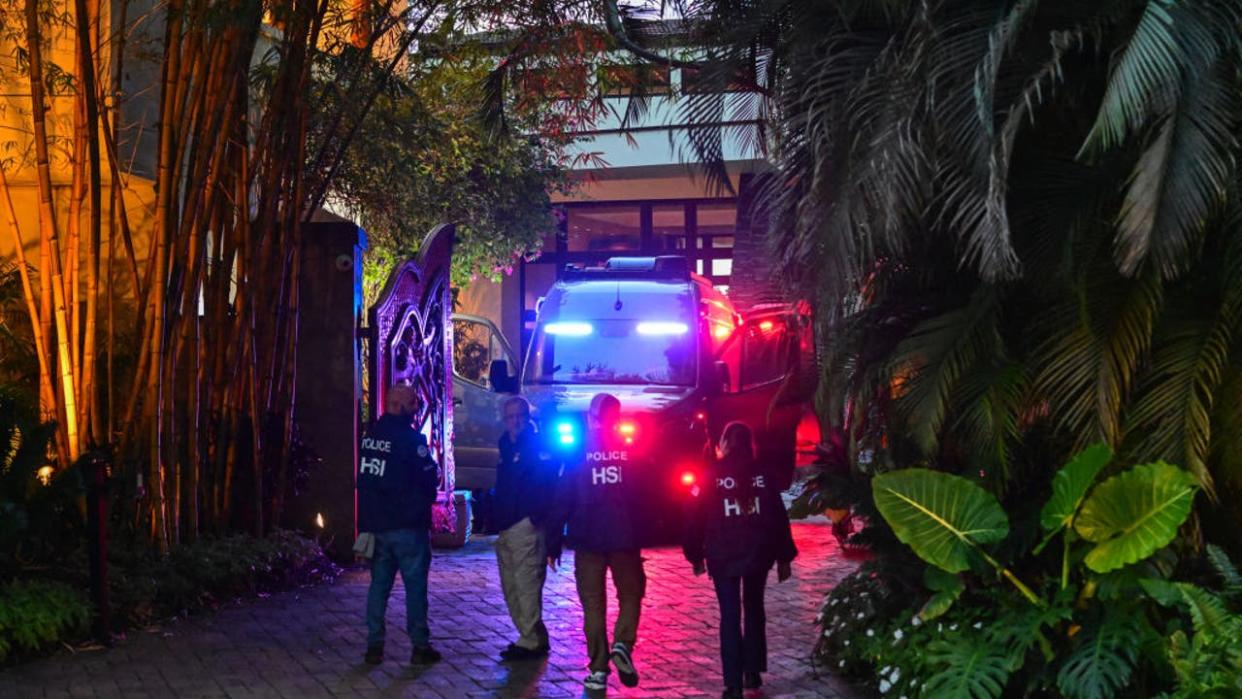 <div>Homeland Security Investigation agents are seen at the entrance of US producer and musician Sean "Diddy" Combs's home at Star Island in Miami Beach on March 25, 2024. Homes belonging to Sean "Diddy" Combs were being raided by federal agents, media reported on March 25, with the US hip hop mogul at the center of sex trafficking and sex assault lawsuits. (Photo by GIORGIO VIERA / AFP) (Photo by GIORGIO VIERA/AFP via Getty Images)</div>