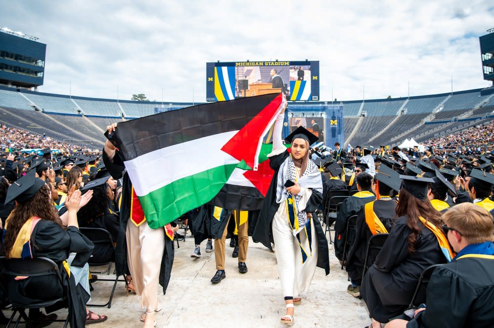 Salma Hamamy, co-president of Students Allied for Freedom and Equality (SAFE), and other pro-Palestinian graduating students protest at the University of Michigan 2024 Spring Commencement on May 4. <span class="copyright">Lila Turner for The Michigan Daily</span>