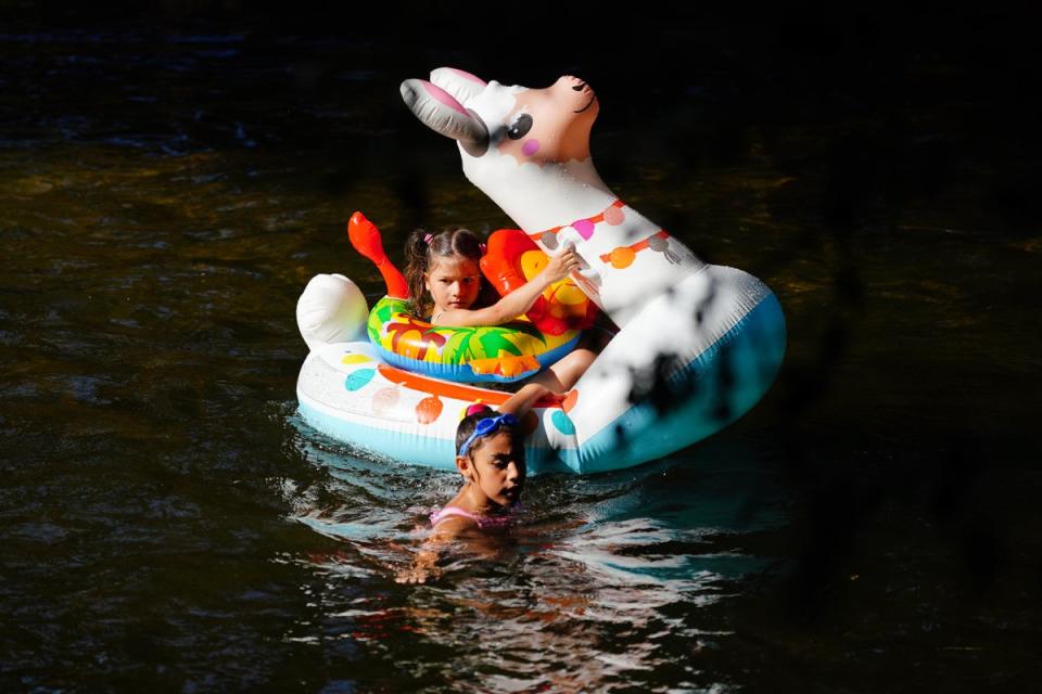 Children playing in the River Lea, east London (Victoria Jones/PA) (PA Wire)