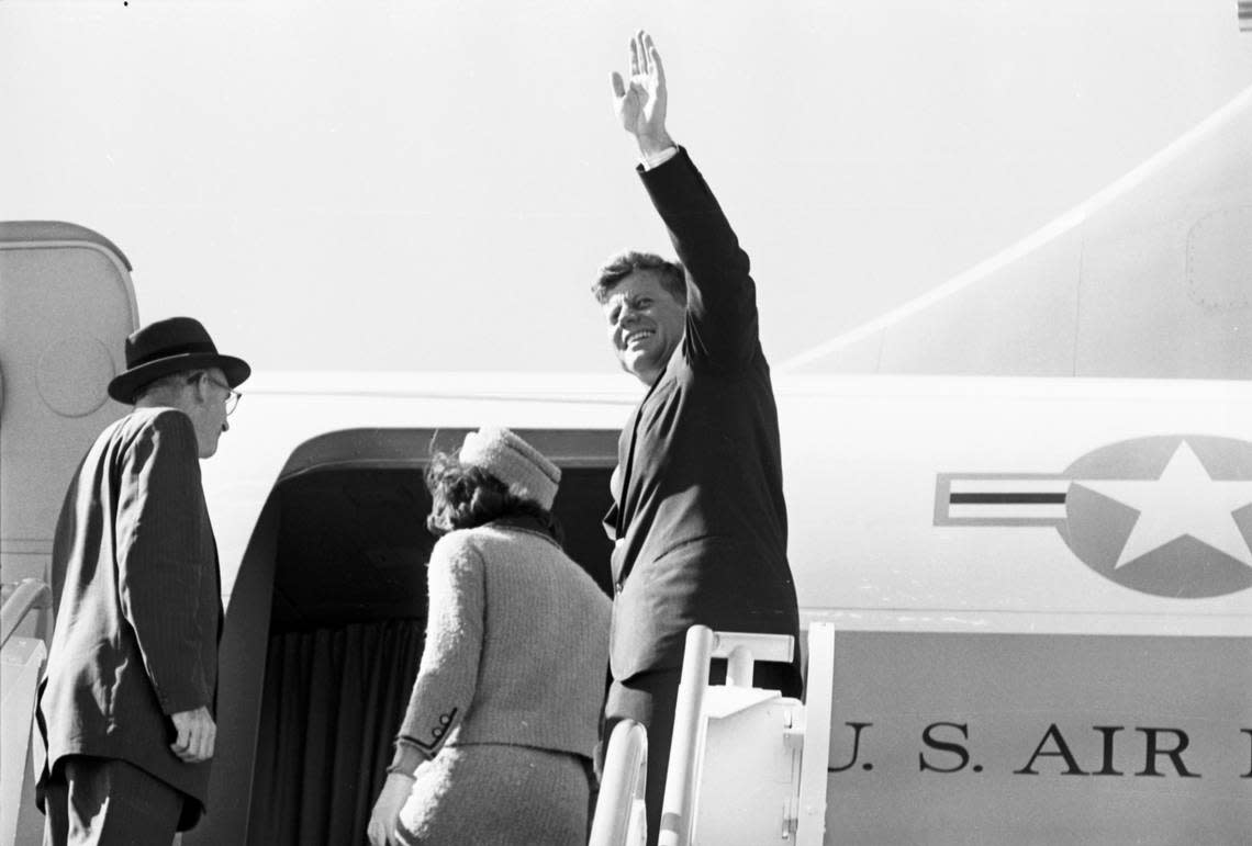 President John F. Kennedy and Jackie Kennedy enter Air Force One to fly from Fort Worth to Dallas. JFK waves to crowd at Carswell Air Force Base. Nov. 22, 1963