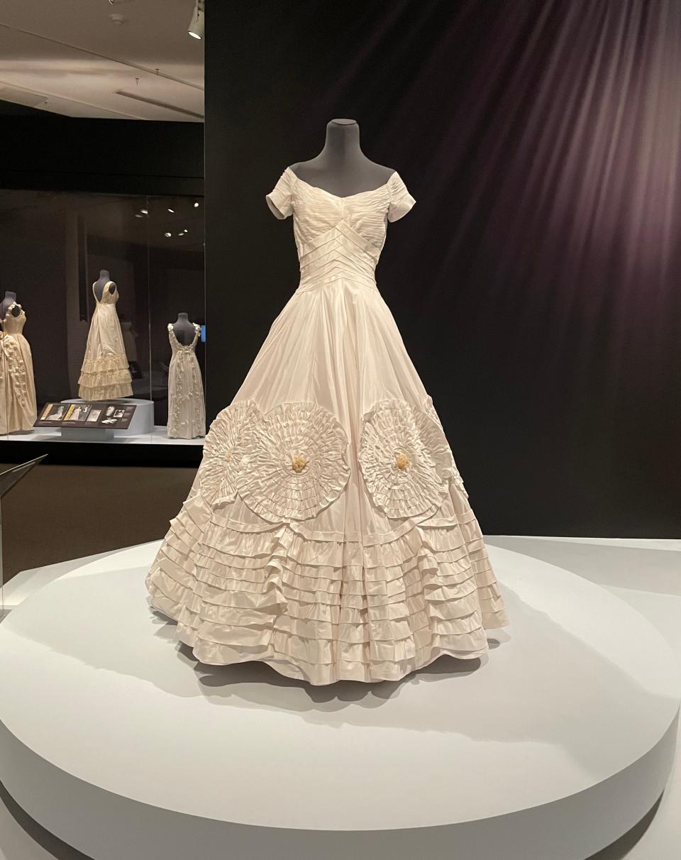 A reproduction of Jacqueline Bouvier Kennedy's wedding dress made by Katya Roelse. Ann Lowe designed the much-publicized 1953 wedding dress, which is in the John F. Kennedy Library.