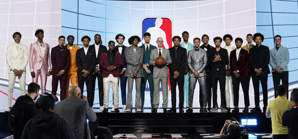 NBA Commissioner Adam Silver, center, poses for a photo with players projected to be first-round draft picks before the NBA basketball draft, Thursday, July 29, 2021, in New York. (AP Photo/Corey Sipkin)