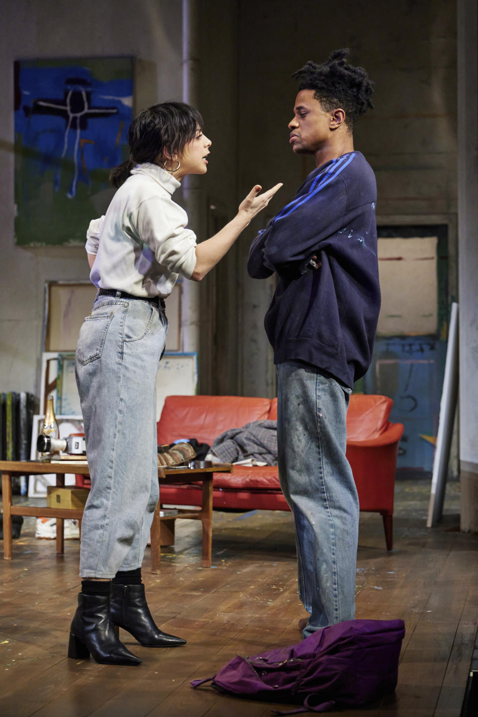This image provided by Jeremy Daniel shows Krysta Rodriguez as Maya, left, and Jeremy Pope as Jean-Michel Basquiat, in a scene from "The Collaboration," Anthony McCarten's fictional account about the real period in 1984 when Andy Warhol was compelled to work with Basquiat, a new sensation and potential rival of the New York art world. (Jeremy Daniel via AP)