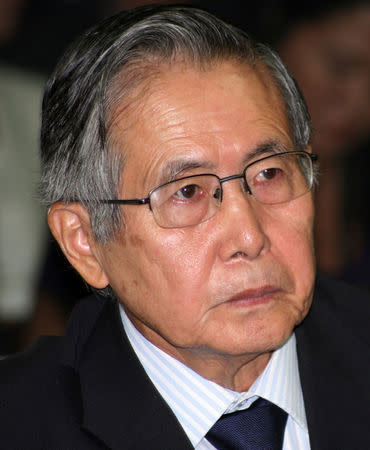 FILE PHOTO - Former Peruvian President Alberto Fujimori listens to his sentence during his trial at the special police headquarters in Lima, Peru April 7, 2009. REUTERS/Francisco Medina/Justice Palace/Handout via Reuters/File Picture