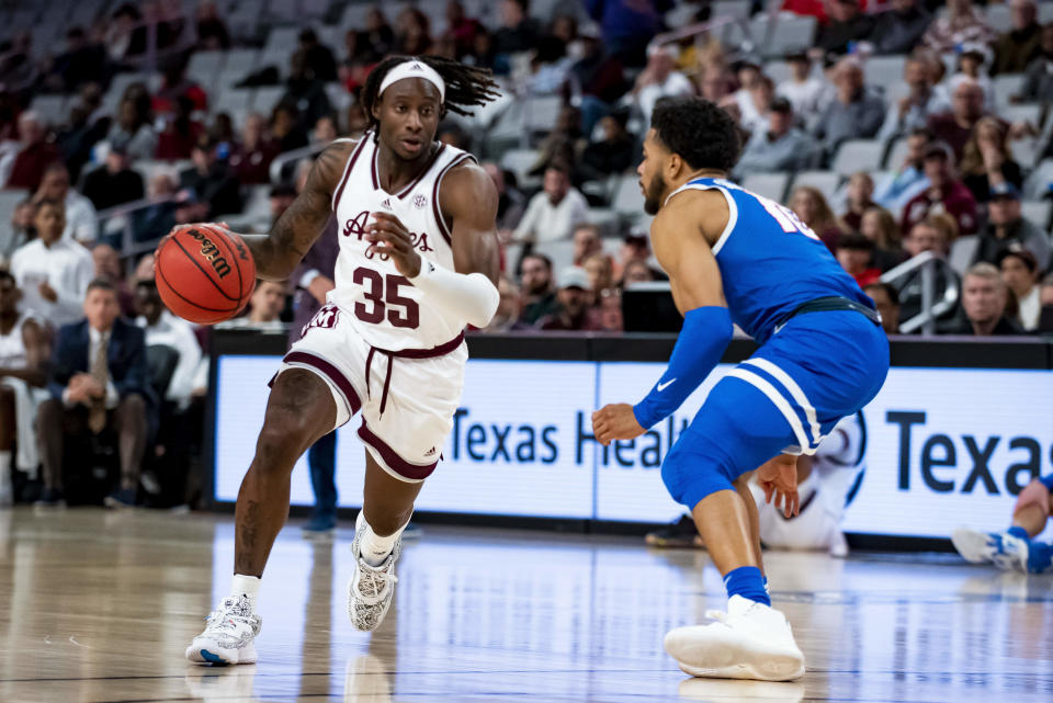 Texas A&M guard Manny Obaseki (35) attempts to drive past Boise State guard Marcus Shaver Jr. during the first half of an NCAA college basketball game in Fort Worth, Texas, Saturday, Dec. 3, 2022. (AP Photo/Emil Lippe)