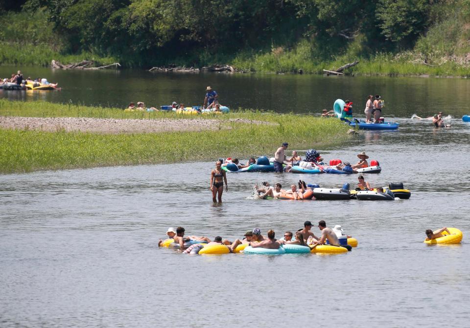 Here, some water enthusiasts enjoy an afternoon on the Raccoon River between Waukee and Van Meter.