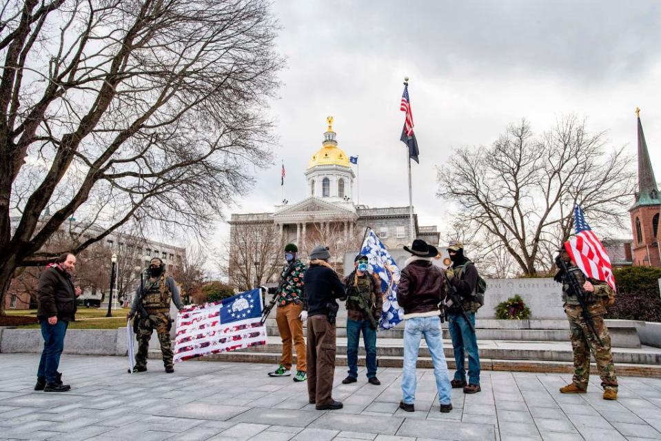 Armed far-right militia members gathered at the statehouse in Concord, New Hampshire, on Sunday. (AFP via Getty Images)