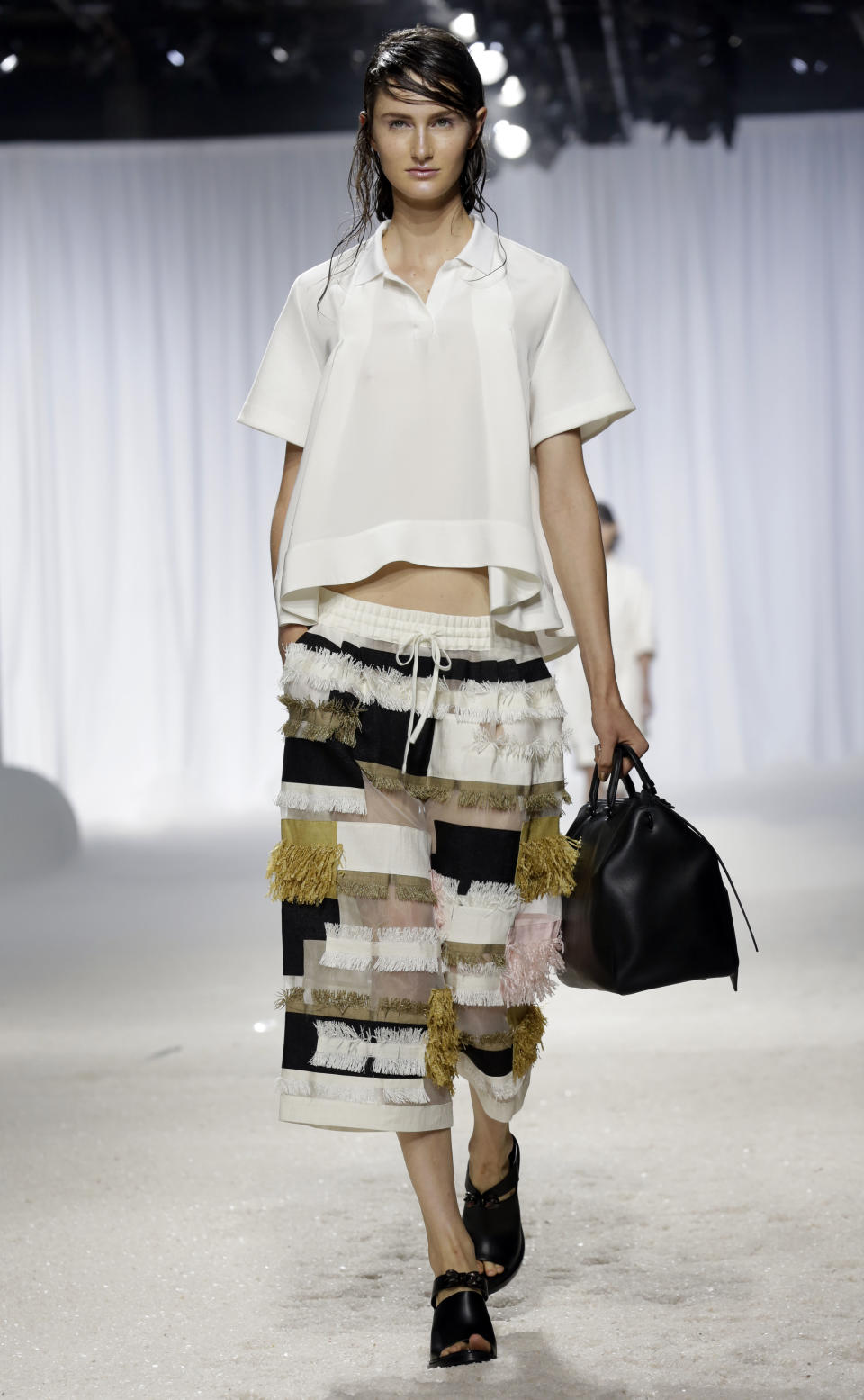 The 3.1 Phillip Lim Spring 2014 collection is modeled during Fashion Week in New York, Monday, Sept. 9, 2013. (AP Photo/Richard Drew)