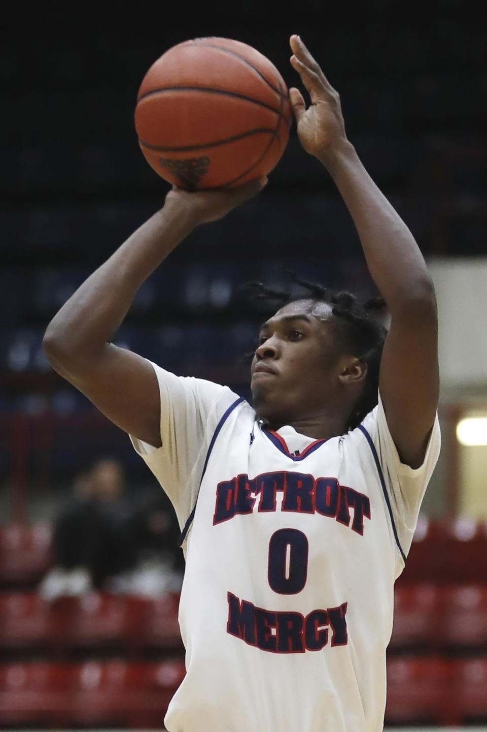 FILE - Detroit Mercy guard Antoine Davis (0) attempts a 3-point basket against IUPUI during the second half of an NCAA college basketball game Thursday, Feb. 28, 2019, in Detroit. Davis, the nation's leading scorer, broke the Division I record for career 3-pointers with a spectacular shooting performance. He made a personal-best 11 3-pointers in a win over Robert Morris last Saturday, Jan. 14, 2023, giving him 513 in a career few saw coming when the 142-pound son of a coach stepped on campus at tiny Detroit Mercy. (AP Photo/Carlos Osorio, File)