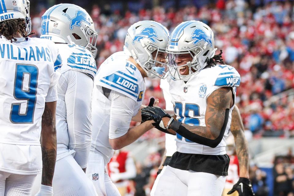 Lions running back Jahmyr Gibbs, right, celebrates a touchdown against 49ers with quarterback Jared Goff during the first half of the NFC championship game at Levi's Stadium in Santa Clara, California, on Sunday, Jan. 28, 2024.