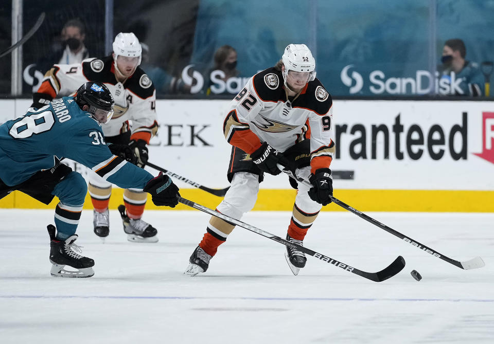 Anaheim Ducks right wing Alexander Volkov (92) skates past San Jose Sharks defenseman Mario Ferraro (38) during the second period of an NHL hockey game, Monday, April 12, 2021, in San Jose, Calif. (AP Photo/Tony Avelar)