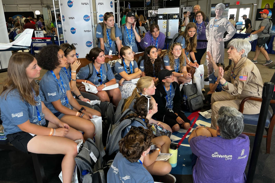 Research pilot Elizabeth “Liz” Ruth speaks with young women from the GirlVenture Camp. (Brenda Lee / EAA Girlventure Camp)