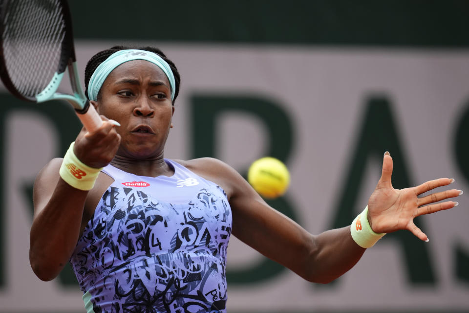 Coco Gauff of the U.S. returns the ball to Estonia's Kaia Kanepi during their third round match of the French Open tennis tournament at the Roland Garros stadium Friday, May 27, 2022 in Paris. (AP Photo/Christophe Ena)