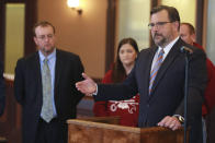 District Attorney John Weddle, right, speaks to reporters Monday, Dec. 6, 2021, at the Pontotoc County Courthouse, in Pontotoc, Miss., regarding information provided to his office by the attorneys of David Neal Cox. Weddle said, before his execution on Nov. 17, Cox told his attorneys he killed his sister-in-law Felicia Cox in 2007 and provided detailed instructions on where investigators could find her remains. (Adam Robison/The Northeast Mississippi Daily Journal via AP)