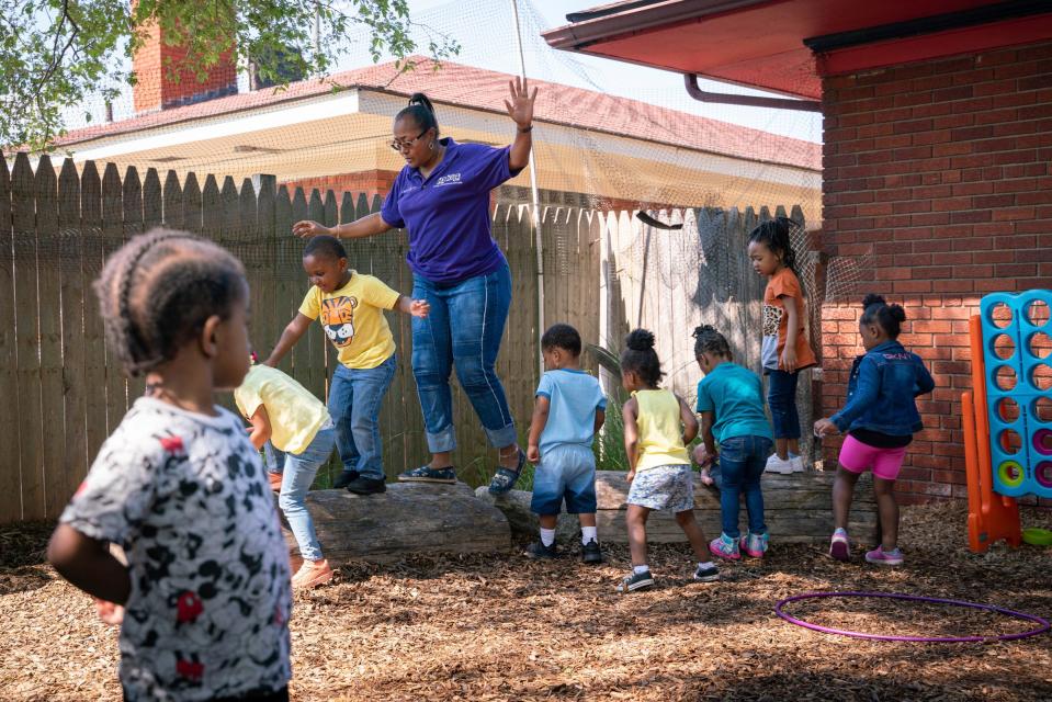 Betty Henderson, 51, plays with children at Angels of Essence Day Care, a 24-hour child care facility she owns and operates, in Detroit on Thursday, July 14, 2022. "We were working 14 to 17 hours around the clock," said Henderson, who has a staff of seven and serves 30 children.