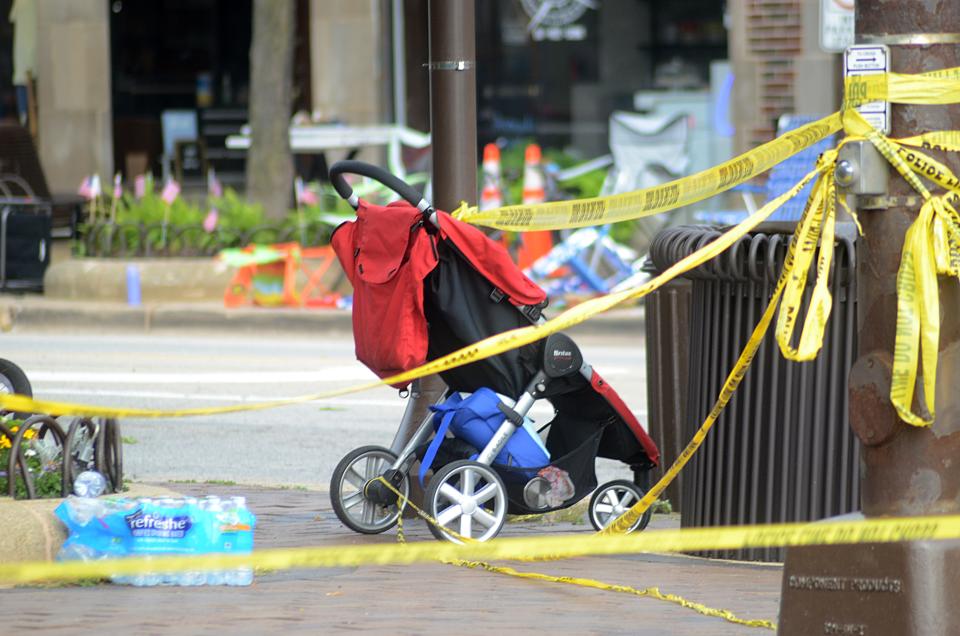 The scene of the mass shooting at an Independence Day parade in Highland Park, Ill., one day later, on Tuesday