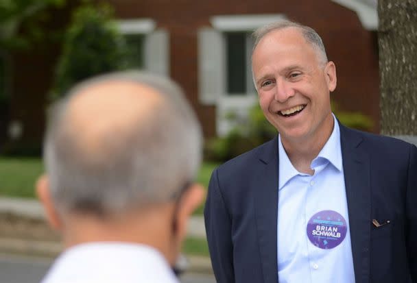 PHOTO: Attorney Brian Schwalb campaigns at the Shepherd Elementary School pooling place during primary election day, June 21, 2022, in Washington. (Astrid Riecken/The Washington Post via Getty Images)
