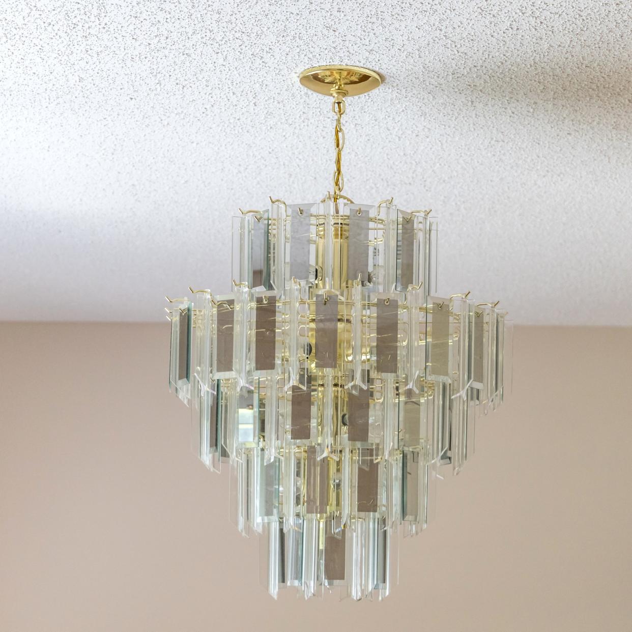  Popcorn ceiling with a glass chandelier 