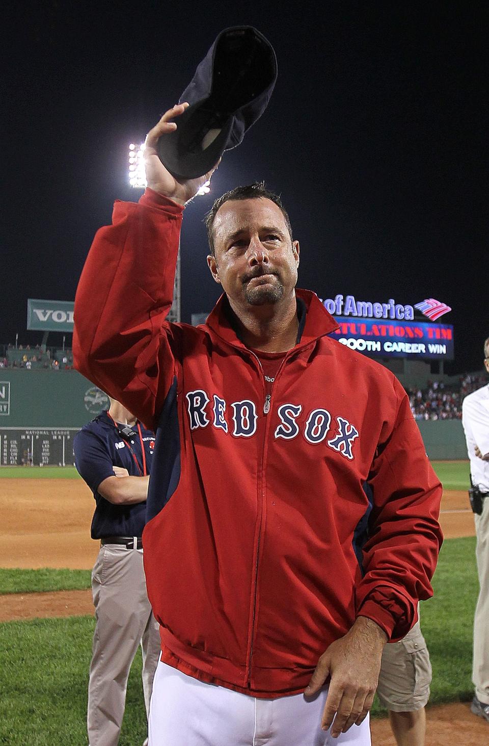 BOSTON, MA - SEPTEMBER 13:  Tim Wakefield #49 of the Boston Red Sox reacts after earning his 200th win after a game with the Toronto Blue Jays at Fenway Park on September 13, 2011 in Boston, Massachusetts. (Photo by Jim Rogash/Getty Images)