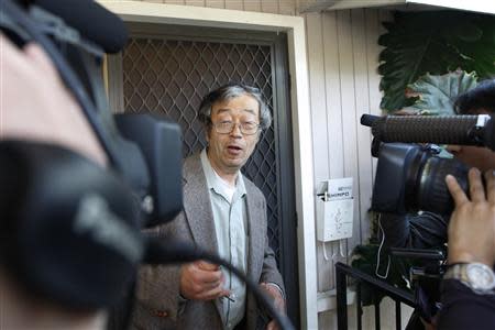 A man widely believed to be Bitcoin currency founder Satoshi Nakamoto is surrounded by reporters as he leaves his home in Temple City, California March 6, 2014. REUTERS/David McNew