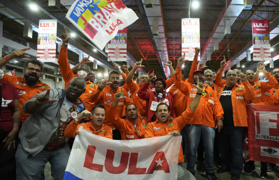 Supporters of former Brazilian President Luiz Inacio Lula da Silva cheer during the announcement of his candidacy for the country’s upcoming presidential election, in Sao Paulo, Brazil, Saturday, May 7, 2022. Brazil's general elections are scheduled for Oct. 2, 2022. (AP Photo/Andre Penner)