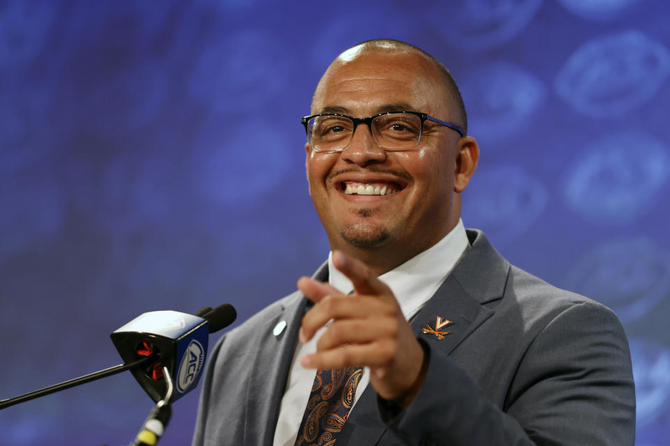 FILE - Virginia head coach Tony Elliott laughs as he answers a question at the NCAA college football Atlantic Coast Conference Media Days in Charlotte, N.C., Thursday, July 21, 2022. Virginia opens their season at Tennessee on Sept. 2. (AP Photo/Nell Redmond, File)