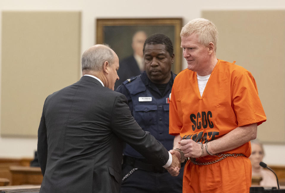 Alex Murdaugh shakes hands with his attorney Jim Griffin during his sentencing for stealing from 18 clients, Tuesday, Nov. 28, 2023, at the Beaufort County Courthouse in Beaufort, S.C. (Andrew J. Whitaker/The Post And Courier via AP, Pool)