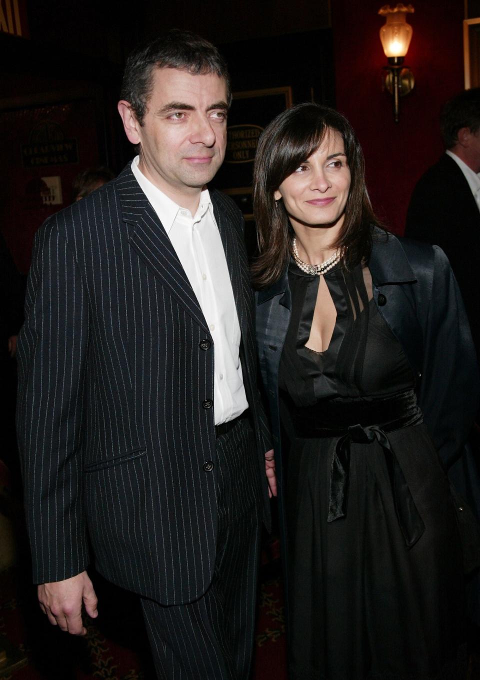 Actor Rowan Atkinson and wife attends the World Premiere of "Love Actually" at the Ziegfeld Theatre November 06, 2003 in New York City.