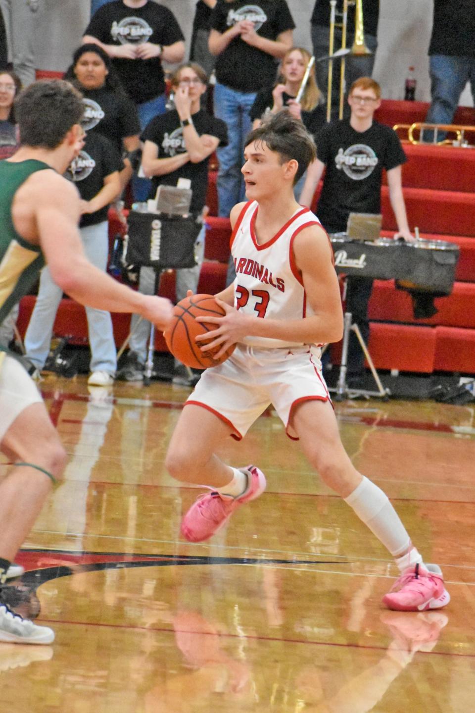 Coldwater's Niko Downs looks to break the Lumen Christi press Friday night