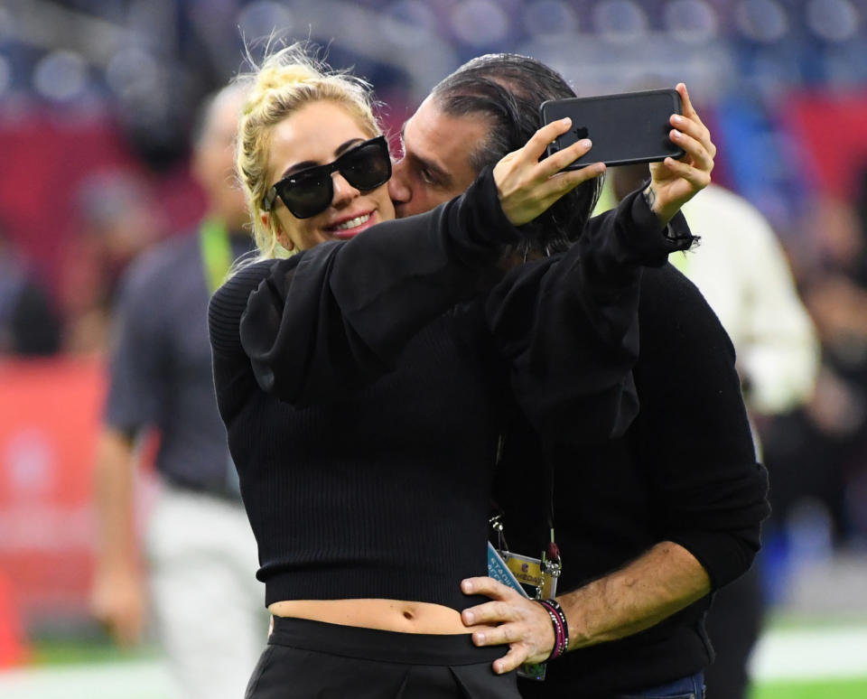 Lady Gaga gets a kiss from Christian Carino before Super Bowl LI. (Photo: USA Today Sports / Reuters)